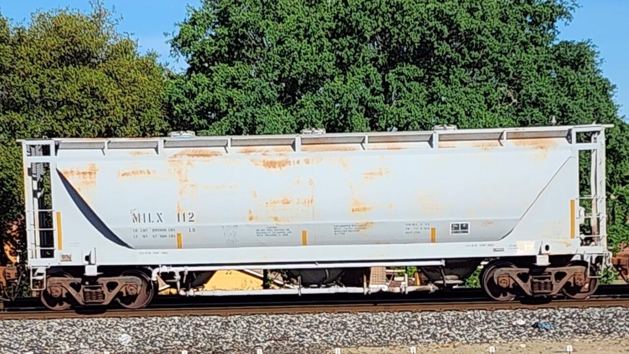 A SLIGHTLY RUSTY 3 BAY CEMENT HOPPER