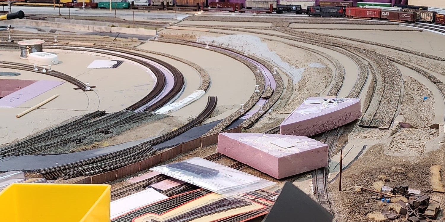AN N SCALE MODEL RAILROAD IN VARYING PHASES OF DESIGN AND CONSTRUCTION