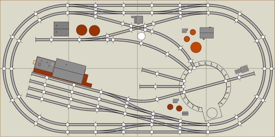 A 2X4 MODEL RAILRAOD TRACK PLAN FEATURING A SMALL YARD AND TURNATBLE, AND AN OIL DISTRIBUTOR